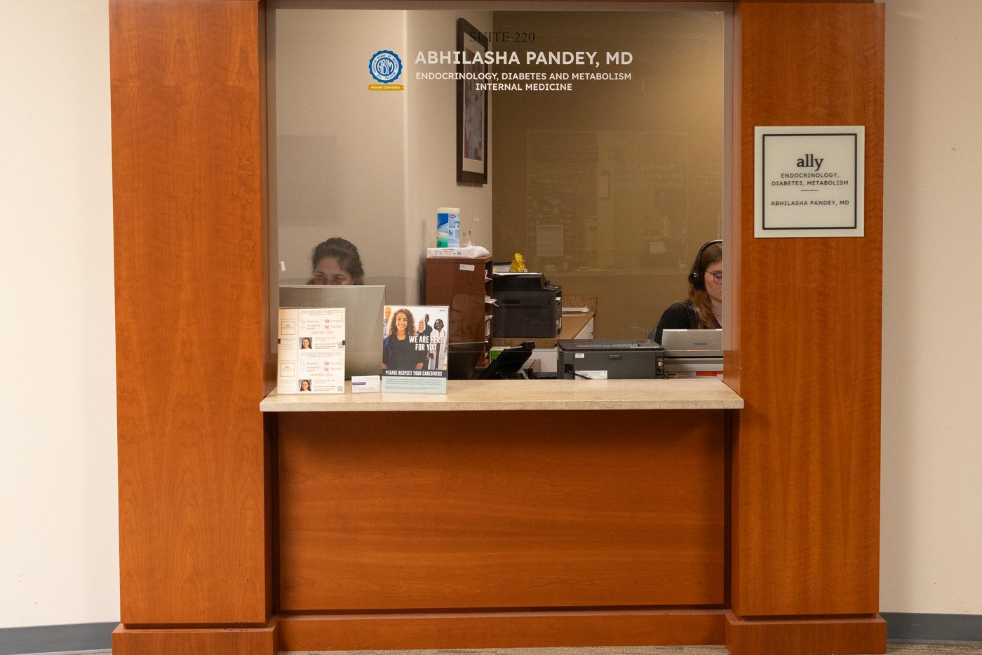 The Ally Endocrinology reception window in Suite 220, with staff ready to check you in